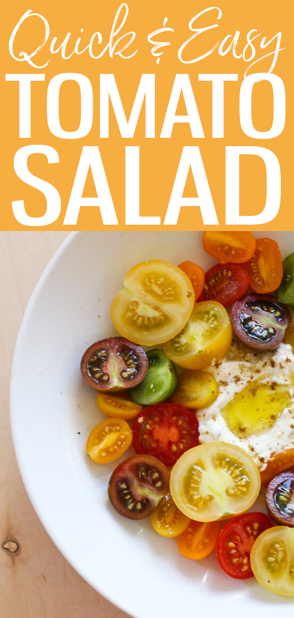This Heirloom Tomato Salad with a Quick Labneh is an amazing summer dish that highlights the best of in season tomatoes! It's the perfect side. #tomatosalad #labnehrecipe