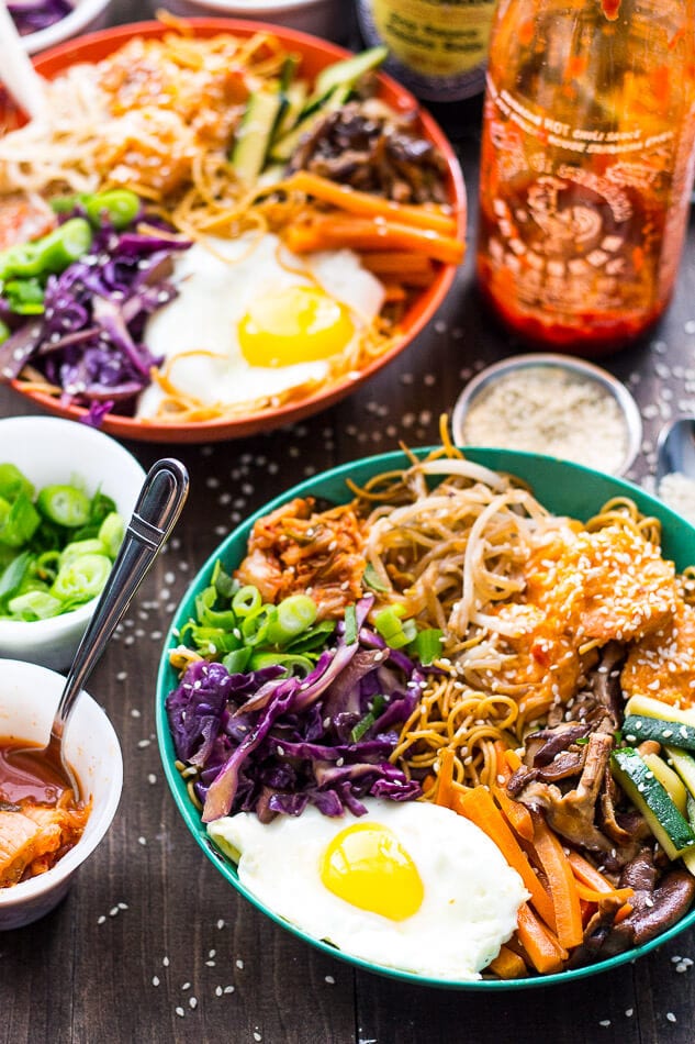 These Bang Bang Shrimp Bibimbap Noodle Bowls are filled with sweet, crunchy chili-garlic shrimp, a fried egg, kimchi and lots of sesame flavoured toppings! 