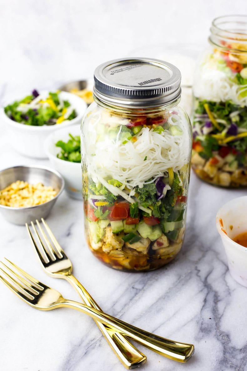 This Sweet Chili Chicken Salad Jars are the perfect grab and go lunch, filled with a delicious kale and red cabbage slaw along with vermicelli noodles and wonton crisps!