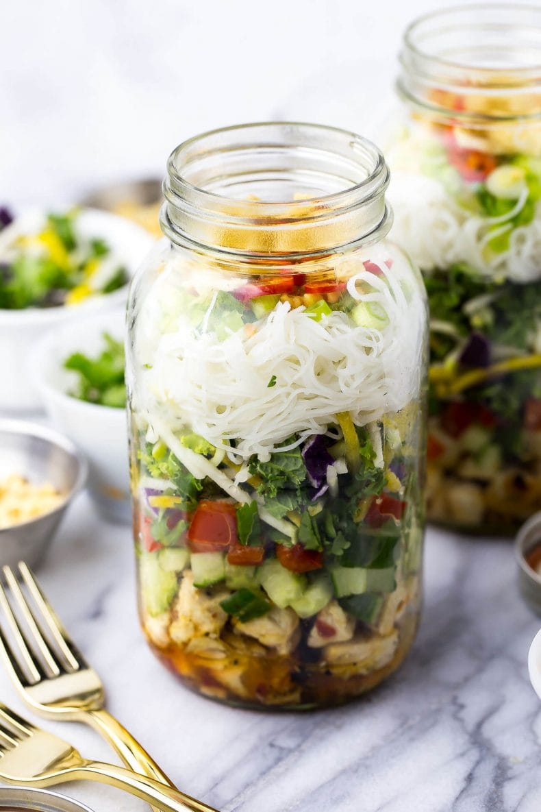 This Sweet Chili Chicken Salad Jars are the perfect grab and go lunch, filled with a delicious kale and red cabbage slaw along with vermicelli noodles and wonton crisps!