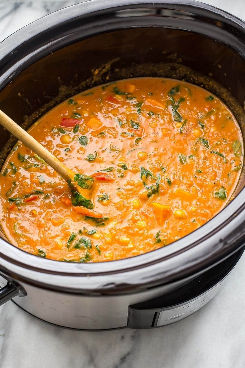 This Slow Cooker African-Inspired Peanut Stew is a hearty, savoury chickpea and sweet potato curry, served with basmati rice and topped with cilantro. It's also gluten-free and vegan!