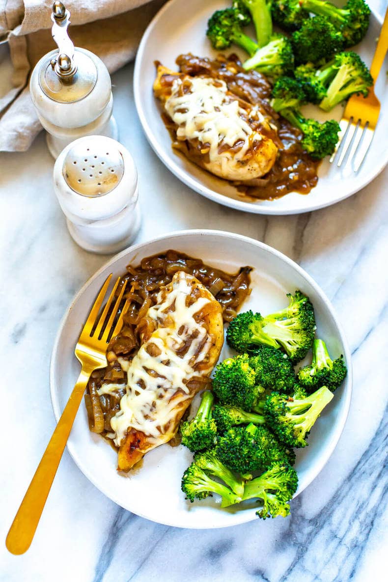 This French Onion Chicken Skillet is a delicious weeknight dinner that is a play on French onion soup and packed with protein, making it a full meal. This will become one of your favorite chicken skillet recipes! plates of French Onion Chicken with steamed broccoli