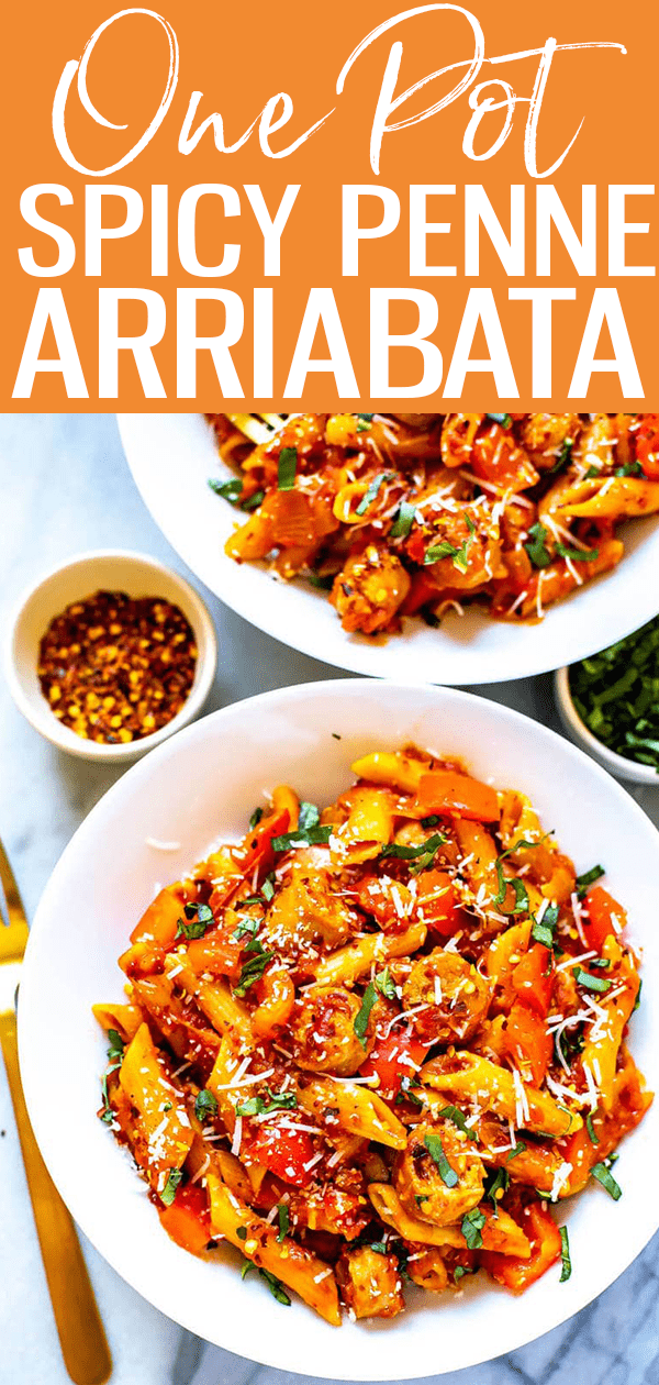 This Spicy Penne Arrabiata is filled with sausage, peppers and onions in a spicy tomato sauce - it comes together in 30 minutes in one pot too! #pennearriabata #onepotpasta