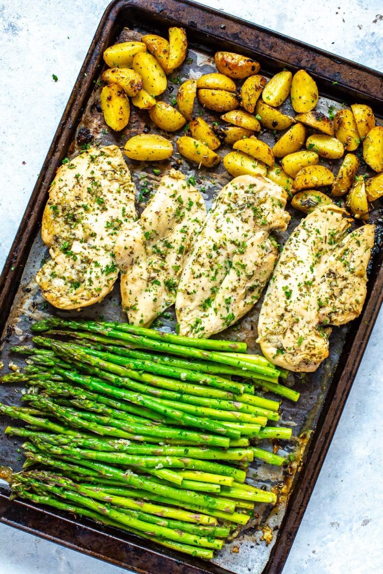 baby potatoes, chicken and asparagus on a sheet pan
