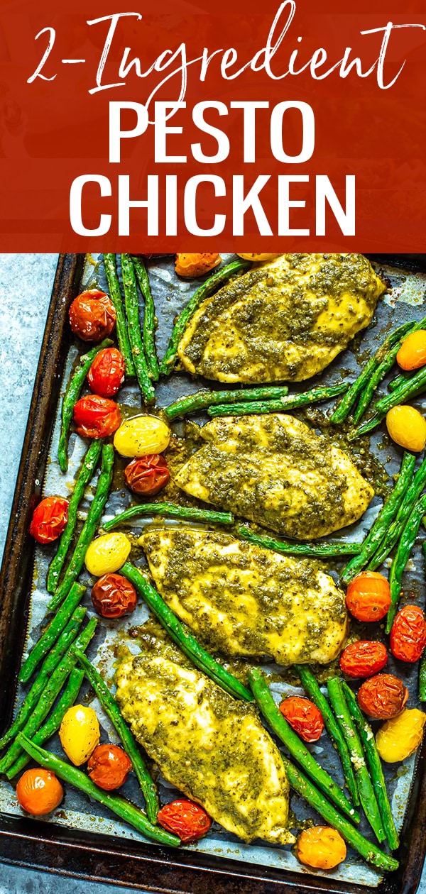 This Baked Pesto Chicken is made easy with just TWO ingredients on a sheet pan for easy clean up. Even with a side of veggies it's ready in just 30 minutes! #pestochicken #sheetpan