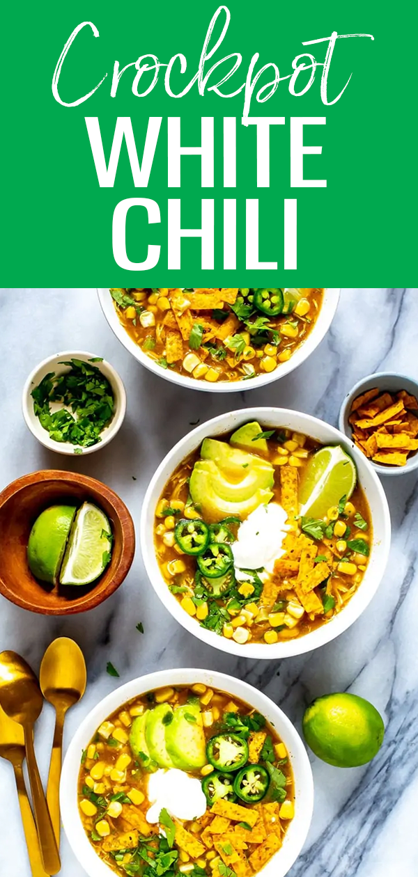 This Crockpot White Chicken Chili is SO easy! It's made in one pot with white beans, and seasoned with green chilies - plus the chicken is so tender! #whitechili #crockpot