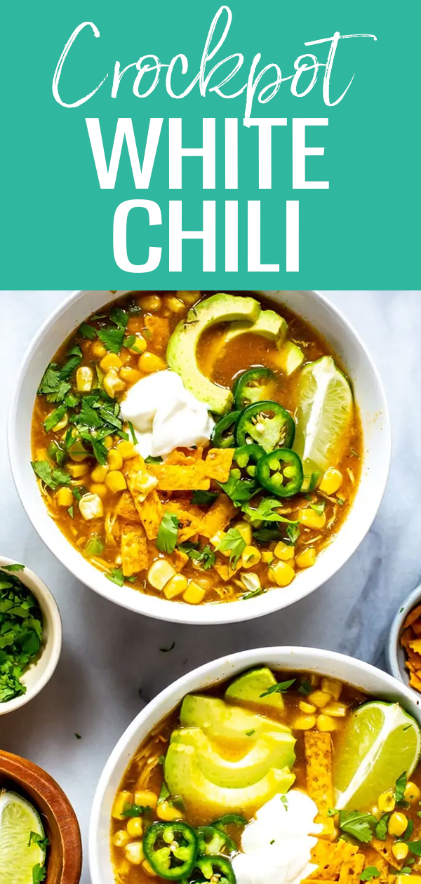 This Crockpot White Chicken Chili is SO easy! It's made in one pot with white beans, and seasoned with green chilies - plus the chicken is so tender! #whitechili #crockpot