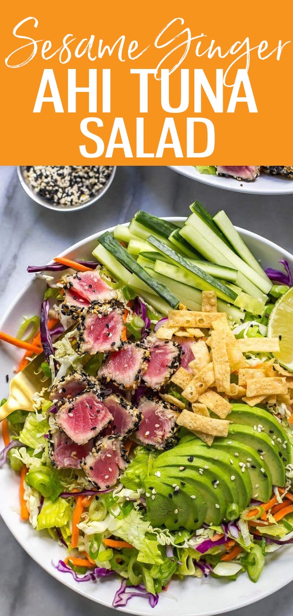 This Ahi Tuna Salad is a colorful, vibrant dish served with seared tuna steaks, sliced avocado, crunchy wontons and a sushi-style sesame ginger dressing #ahitunasalad