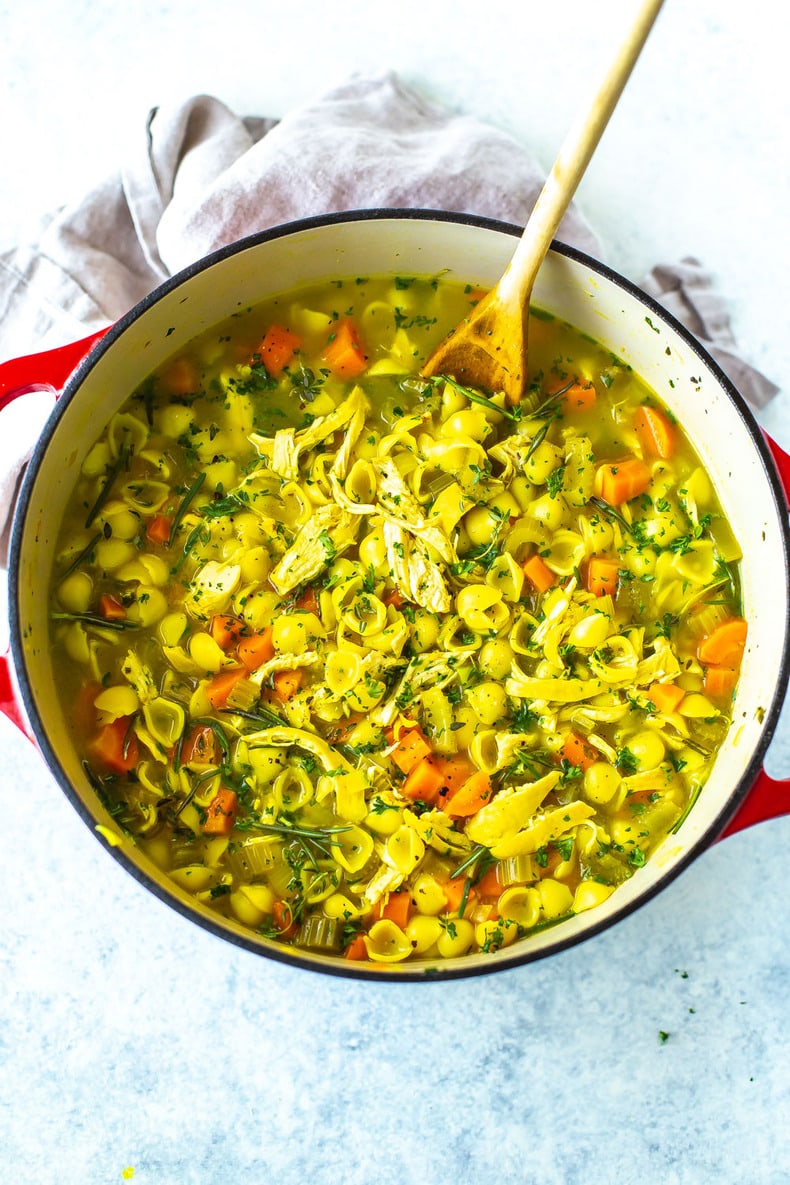 Close up of Chicken Soup with wooden spoon