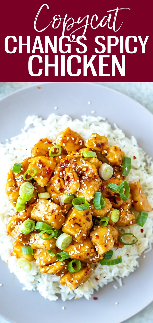 This Copycat Chang's Spicy Chicken recipe is the perfect sweet and spicy stir fry served over rice and garnished with sesame seeds and scallions! #changsspicychicken