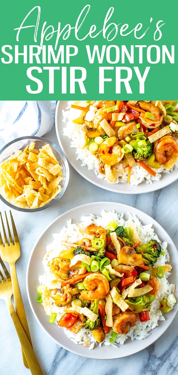 This Shrimp Wonton Stir Fry is an Applebee's copycat filled with veggies tossed in a sweet and spicy sauce, served over rice & topped with wonton strips. #applebees #shrimpwontonstirfry