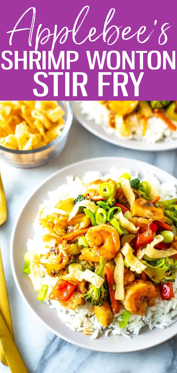 This Shrimp Wonton Stir Fry is an Applebee's copycat tossed in a sweet and spicy sauce, served over rice and topped with wonton strips. #applebees #shrimpwontonstirfry