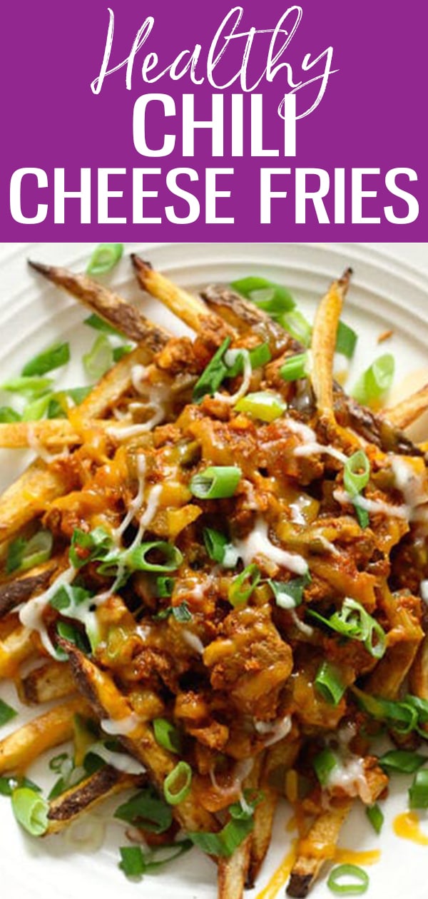 Chili cheese fries are the perfect game day meal! Crispy potatoes are covered in chili, melted cheeses, and your favorite fixings! #chilicheesefries
