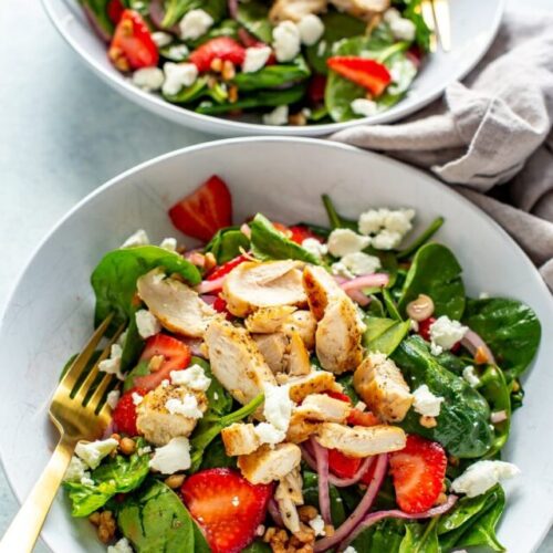 2 bowls of strawberry spinach salad with chicken