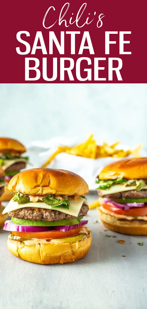 This Chili's Santa Fe Burger is a perfect copycat, stacked with avocado, Monterey Jack, red onion, jalapenos, tomato, cilantro & spicy sauce. #chilicopycat #santafeburger