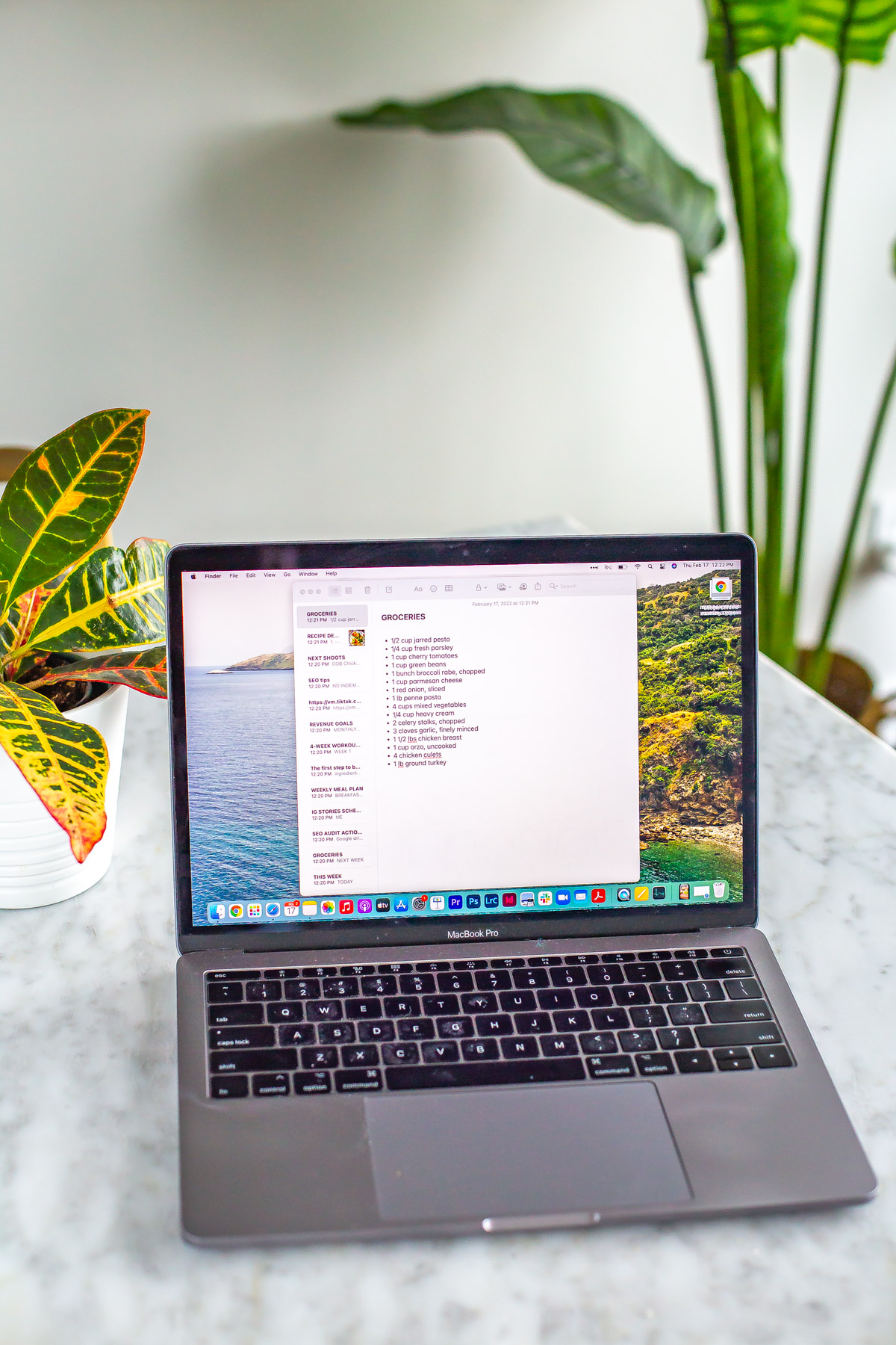 Image of a laptop with a grocery list appearing in a note document on the computer.