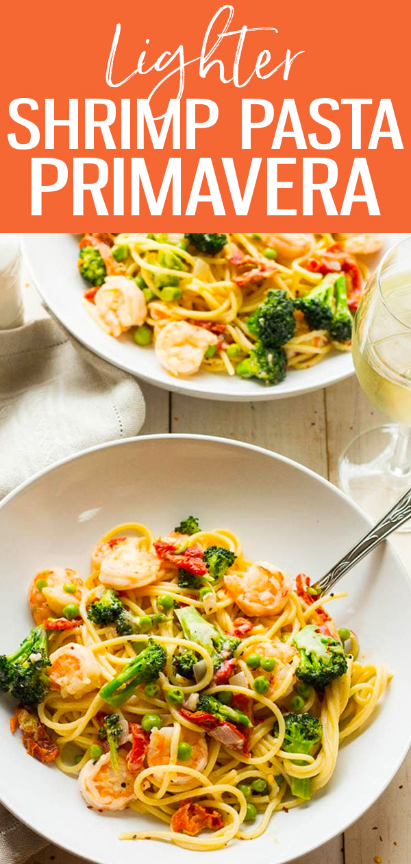 This Lighter Shrimp Pasta Primavera recipe is ready in just 30 minutes, made with fresh veggies, yummy shrimp and the creamiest sauce! #shrimp #pasta