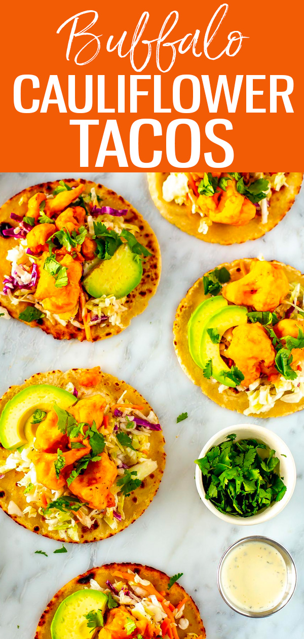 These vegetarian Buffalo Cauliflower Tacos with coleslaw, avocado and ranch are SO addictive - even meat eaters will devour them! #buffalocauliflower #tacos