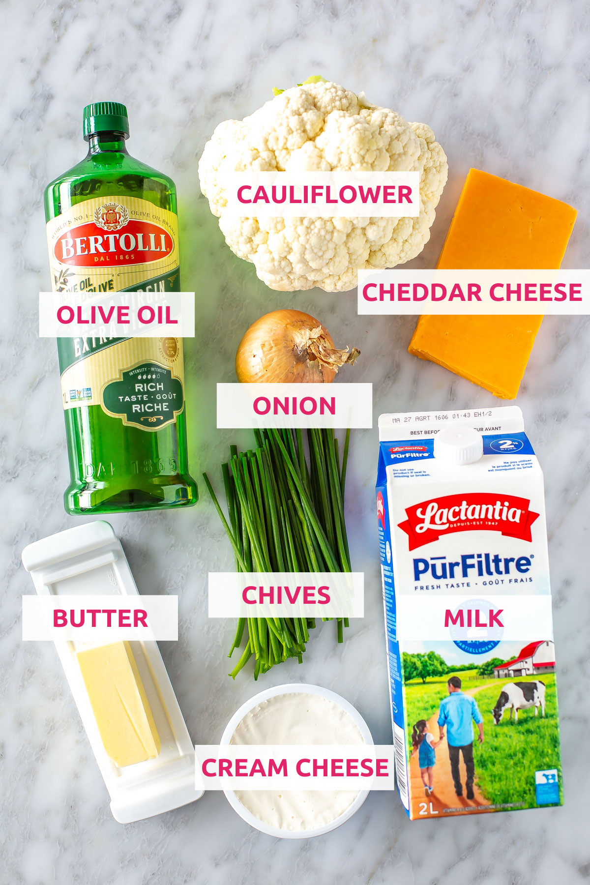 Ingredients for cauliflower mac and cheese: olive oil, cauliflower, cheddar cheese, milk, onion, chives, butter and cream cheese.