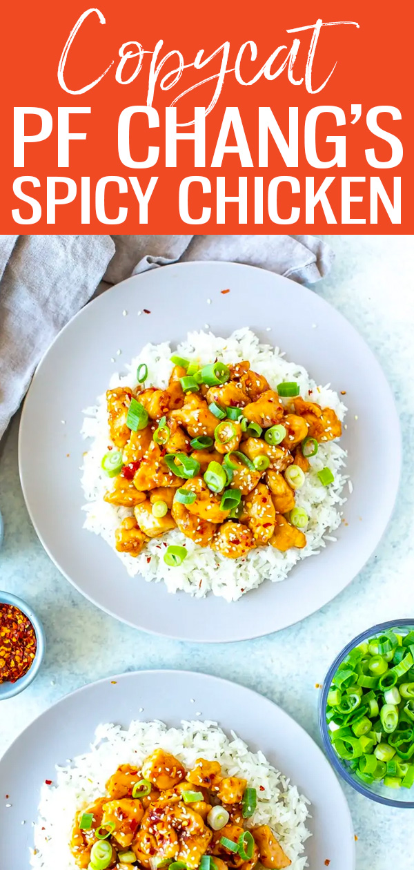 This Copycat PF Chang's Spicy Chicken recipe is the perfect sweet and spicy stir fry served over rice with sesame seeds and scallions! #pfchangs #copycatrecipe #spicychicken