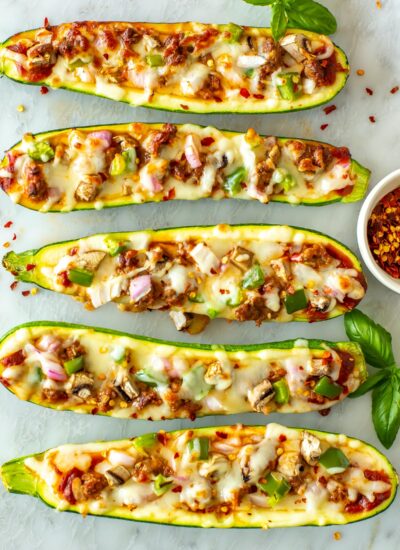Zucchini pizza boats loaded with toppings.
