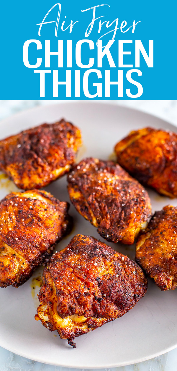 These Air Fryer Chicken Thighs are so crispy and juicy, seasoned with lemon pepper and paprika, and served with rice and coleslaw. #airfryer #chickenthighs