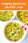 overhead shot of the dish with orange banner on the top reading "panera broccoli cheddar soup"