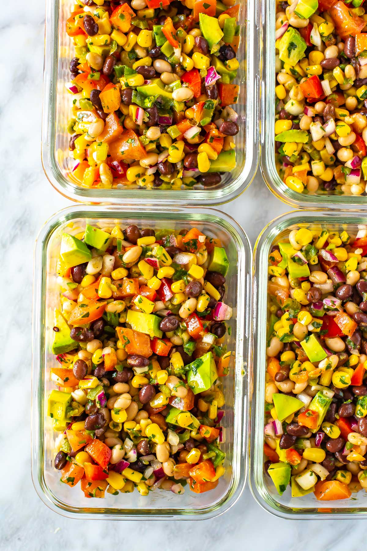 A close-up for a meal prep container filled with cowboy caviar.