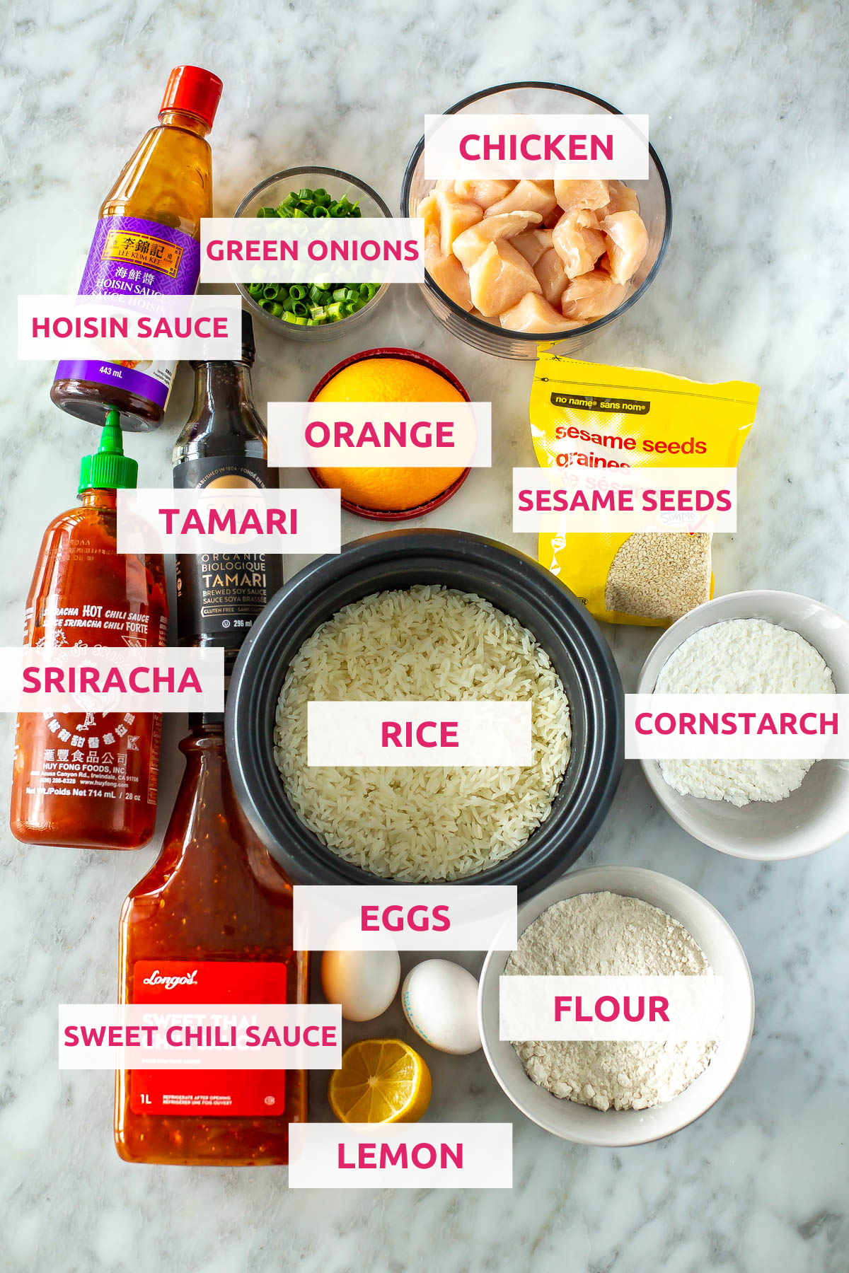 Ingredients for mandarin chicken: hoisin sauce, green onions, chicken, tamari, orange, sesame seeds, sriracha, rice, cornstarch, flour, eggs, lemon, and sweet chili sauce.