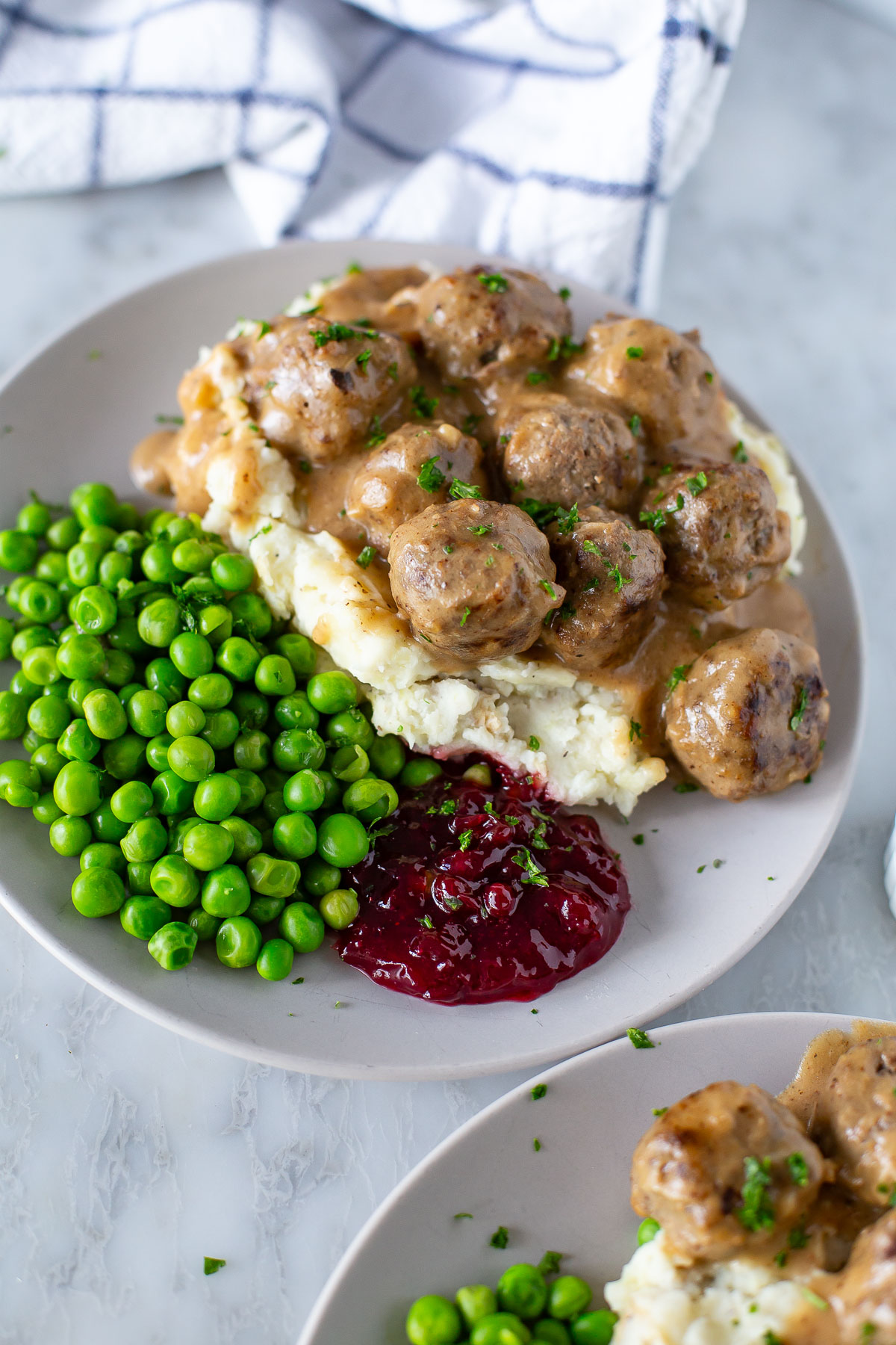 Swedish meatballs with peas and lingonberry jam