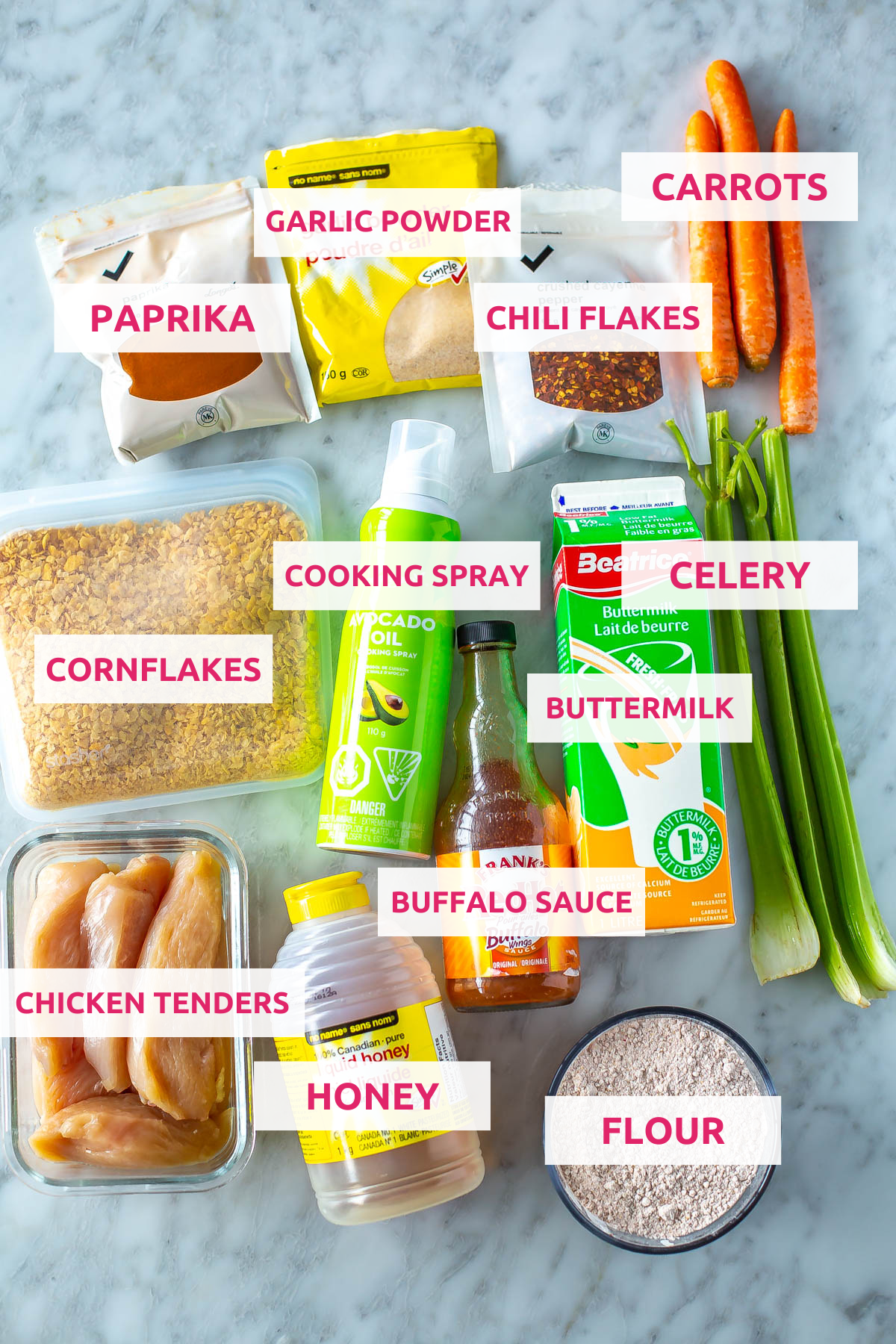 Ingredients for air fryer chicken tenders: chicken tenders, cornflakes, flour, buttermilk, cooking spray, paprika, garlic powder, chili flakes, carrots, celery, honey and buffalo sauce.