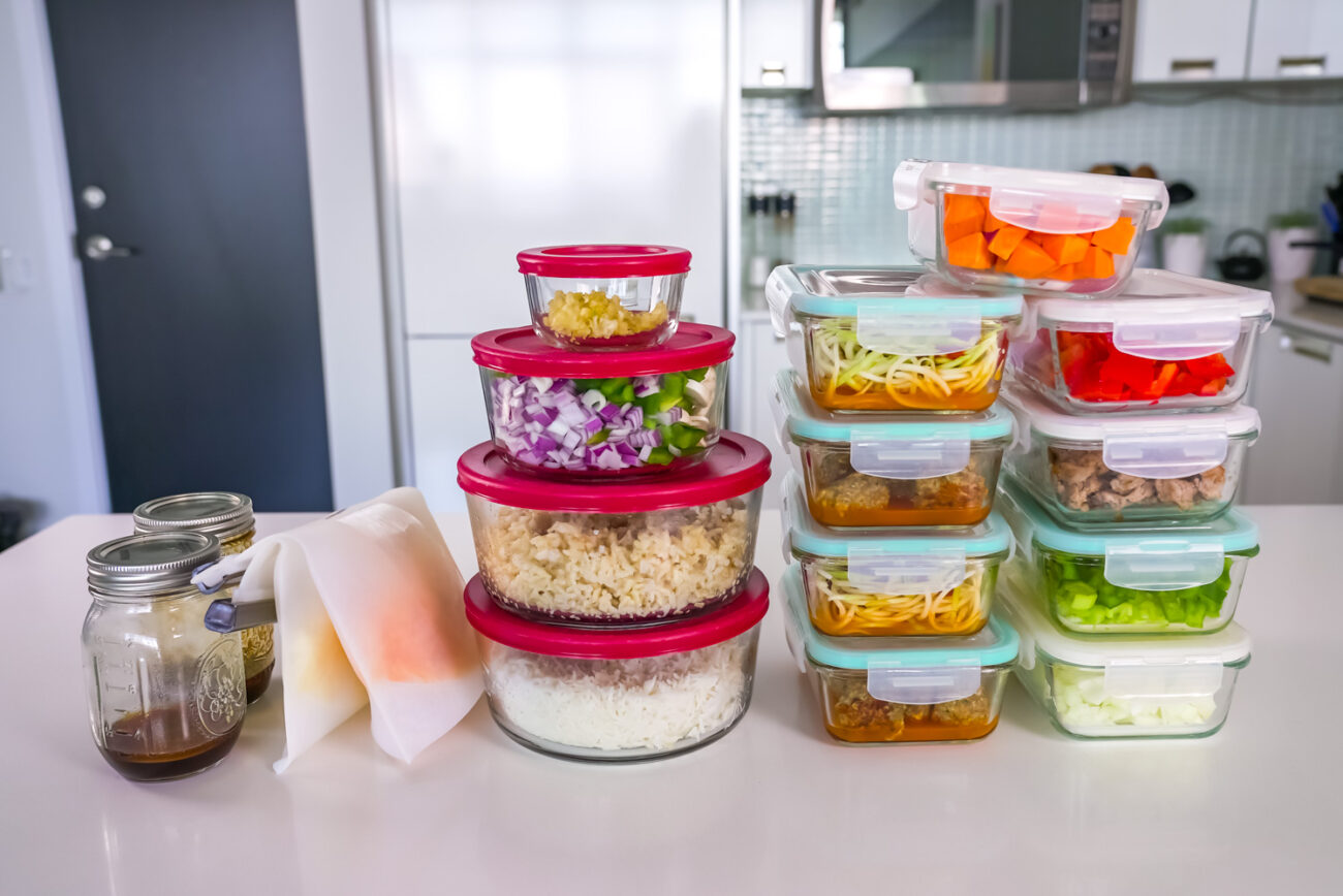 A bunch of prepped ingredients on a counter ready for meal prep.