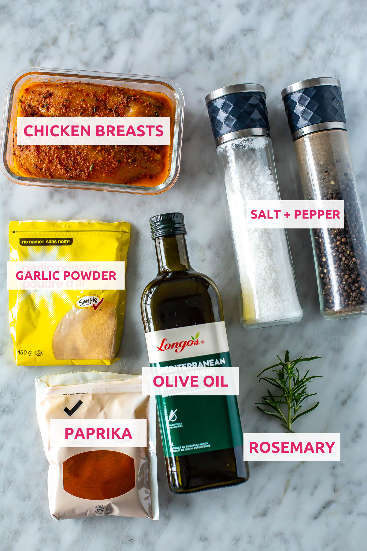 Ingredients for air fryer chicken breasts: chicken breasts, garlic powder, paprika, olive oil, fresh rosemary, salt and pepper.
