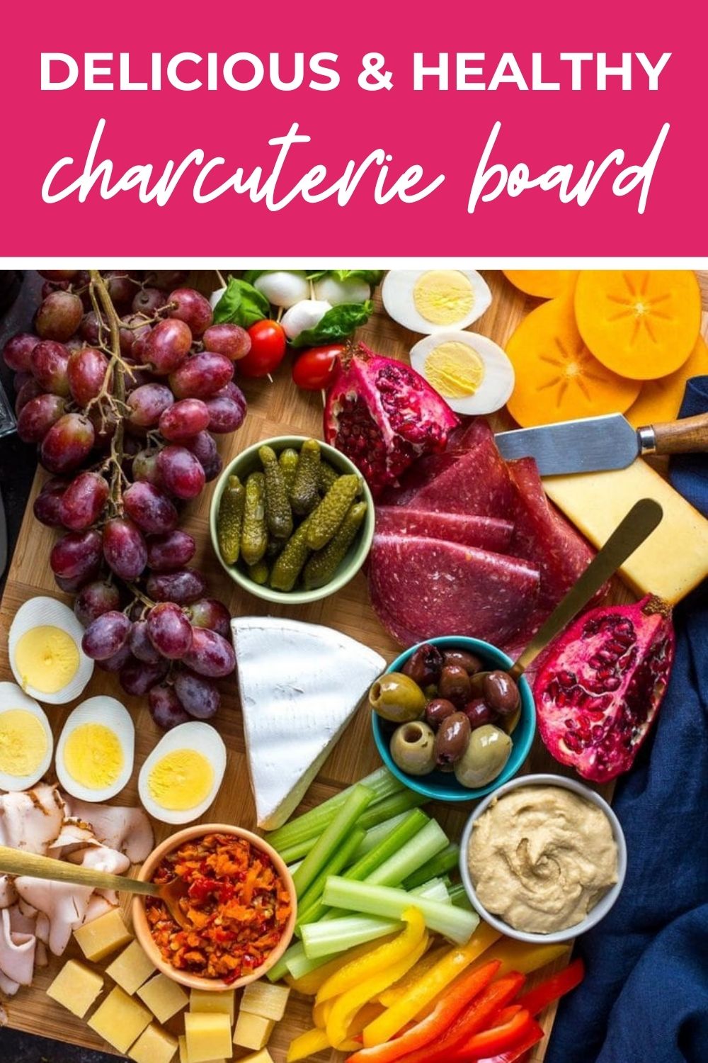 Overhead shot of a charcuterie board, with text that says 'Delicious & Healthy Charcuterie Board'