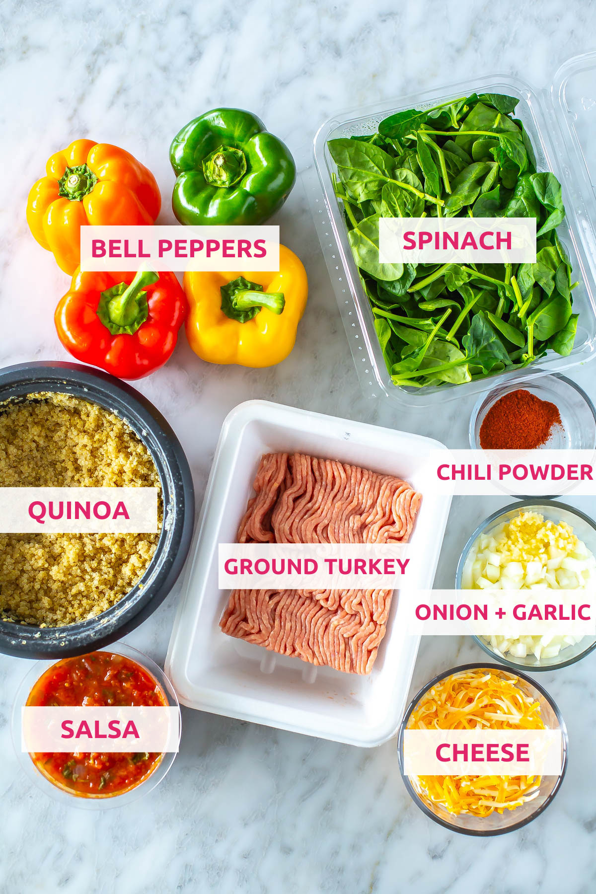 Ingredients for air fryer stuffed peppers: quinoa, bell peppers, spinach, chili powder, ground turkey, onion, garlic, cheese and salsa.