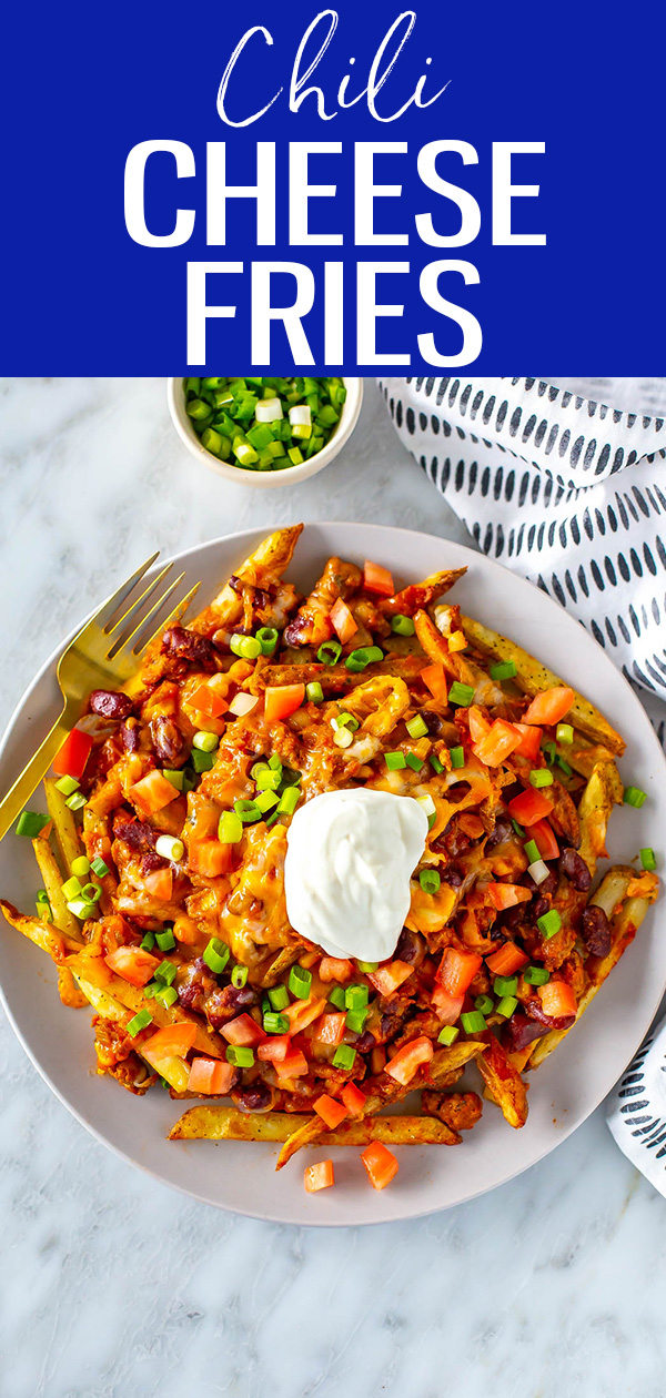 This is the Ultimate Chili Cheese Fries Recipe! Crispy potatoes are covered in chili, melted cheese and your favourite fixings. #chilicheesefries #chili #fries
