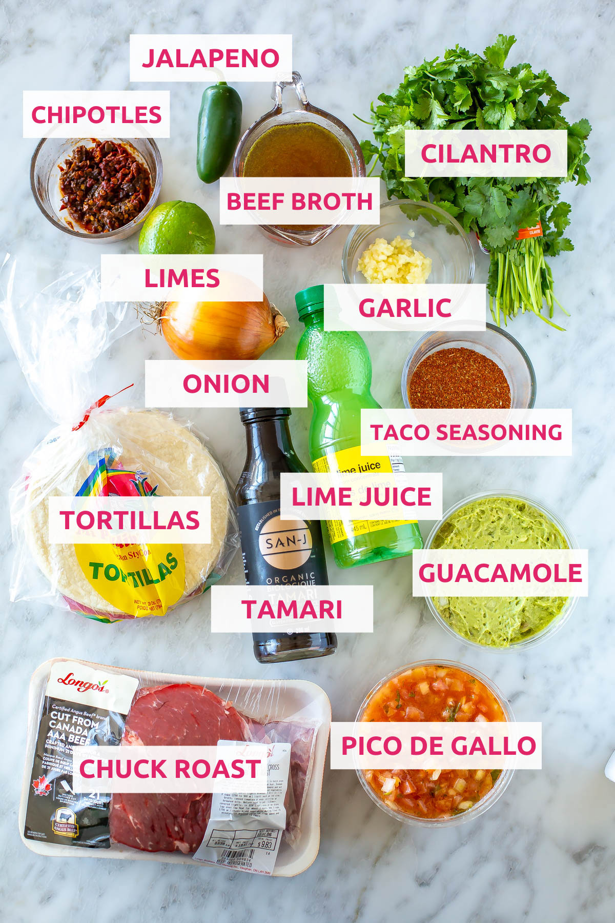 Ingredients for shredded beef taco: chuck roast, pico de gallo, guacamole, tortillas, tamari, lime juice, taco seasoning, cilantro, garlic, chipotles, beef broth, jalapeno, limes and onion.
