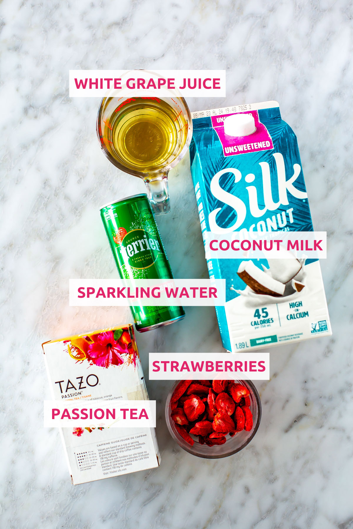 Ingredients for Starbucks pink drink: strawberries, coconut milk, sparkling water, white grape juice and passion tea.