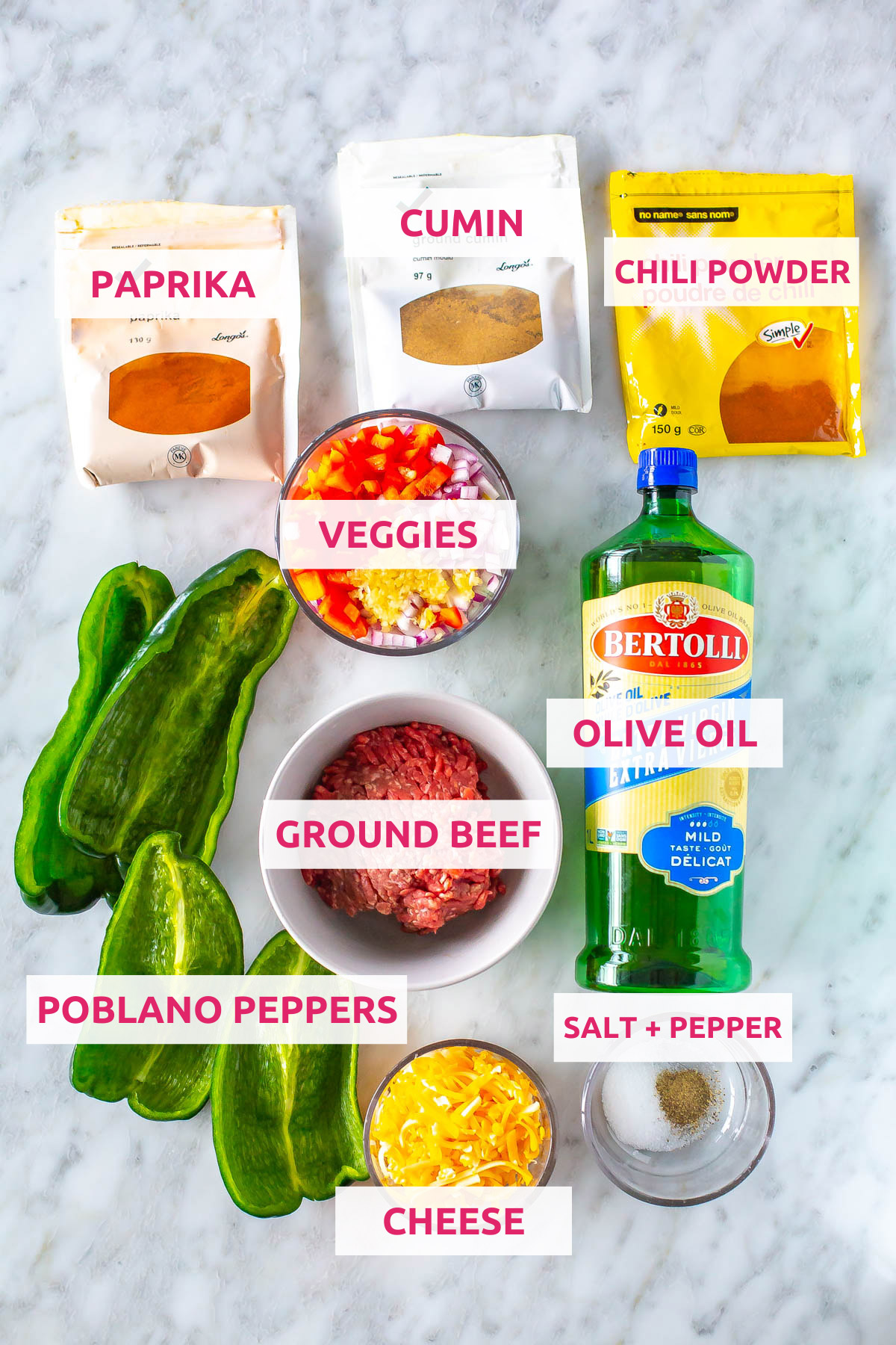 Ingredients for stuffed poblano peppers: poblano peppers, cheese, ground beef, veggies, olive oil, salt, pepper, chili powder, cumin, and paprika.