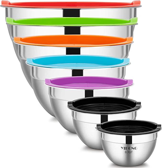 A set of stainless steel mixing bowls with different colour lids.