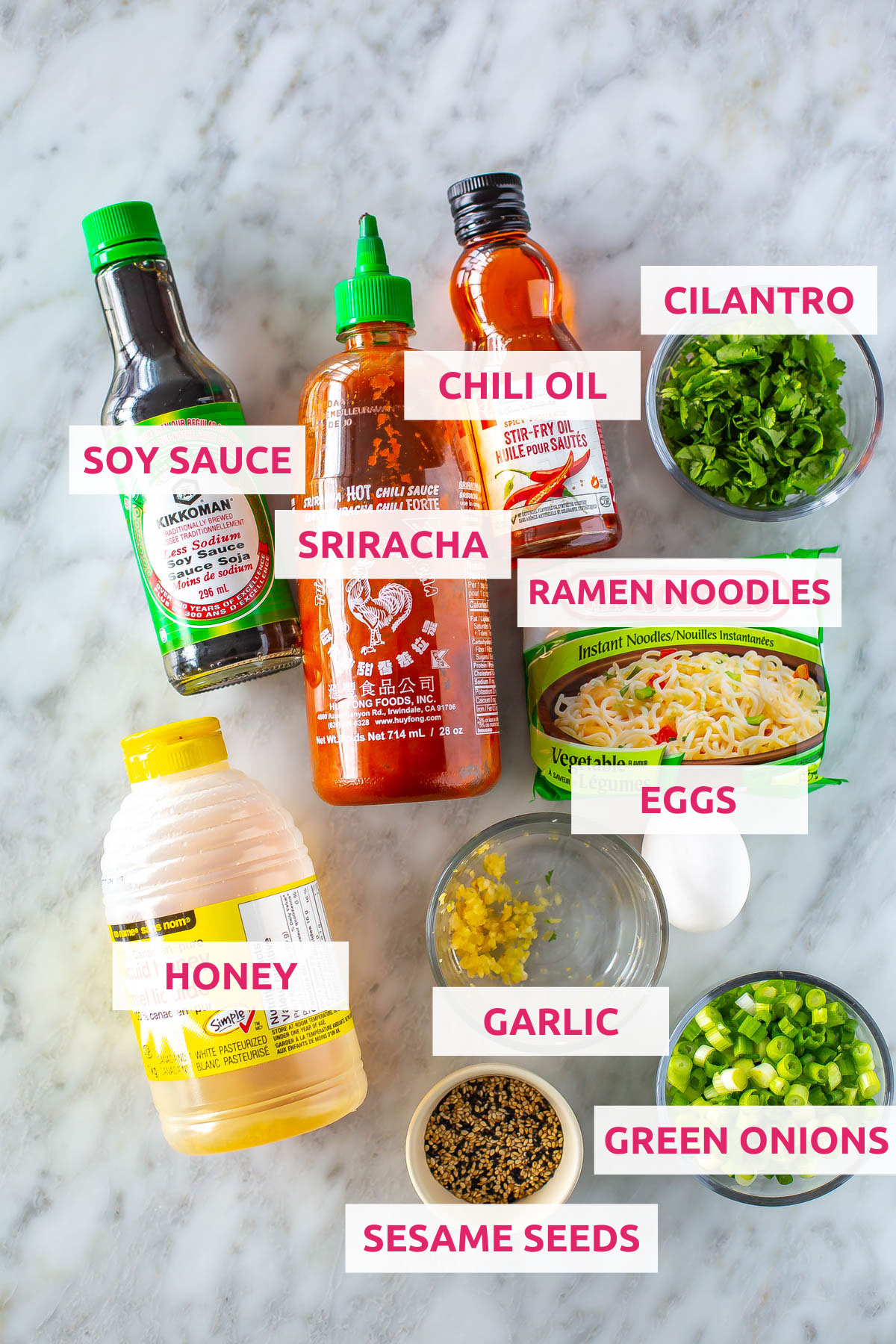 Ingredients for spicy noodles: ramen noodles, sriracha, chili oil, cilantro, soy sauce, honey, garlic, green onions and sesame seeds.