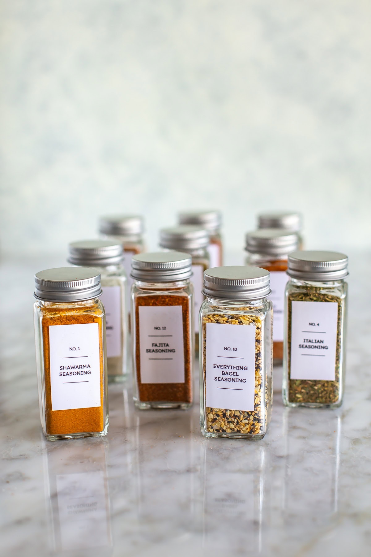 A bunch of homemade spice blends in different jars.