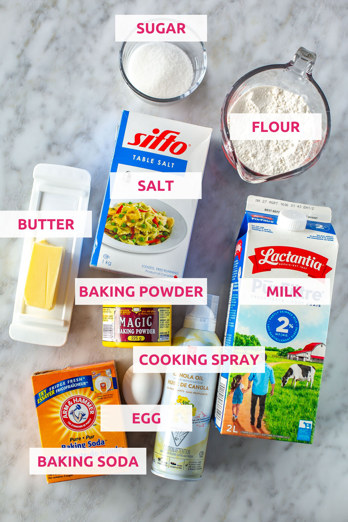 Ingredients for sheet pan pancakes: flour, sugar, salt, butter, baking soda, baking powder, egg, cooking spray and milk.