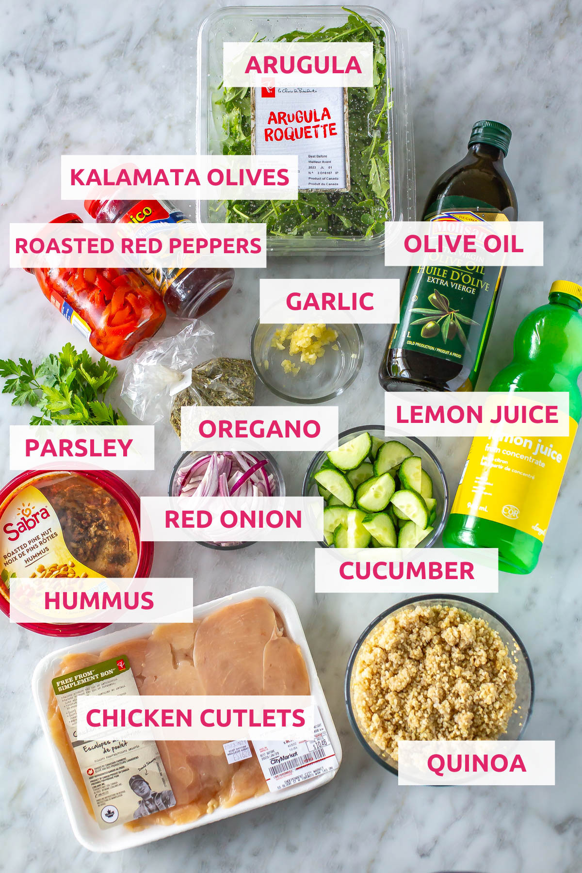 Ingredients for mediterranean bowls: arugula, olives, roasted red peppers, olive oil, parsley, oregano, lemon juice, cucumbers, red onion, hummus, chicken cutlets and quinoa.