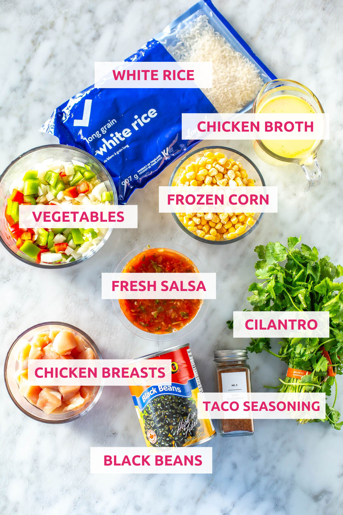 Ingredients for Instant Pot Chicken Burrito Bowls: white rice, vegetables, chicken broth, frozen corn, chicken breasts, salsa, black beans, taco seasoning and cilantro.