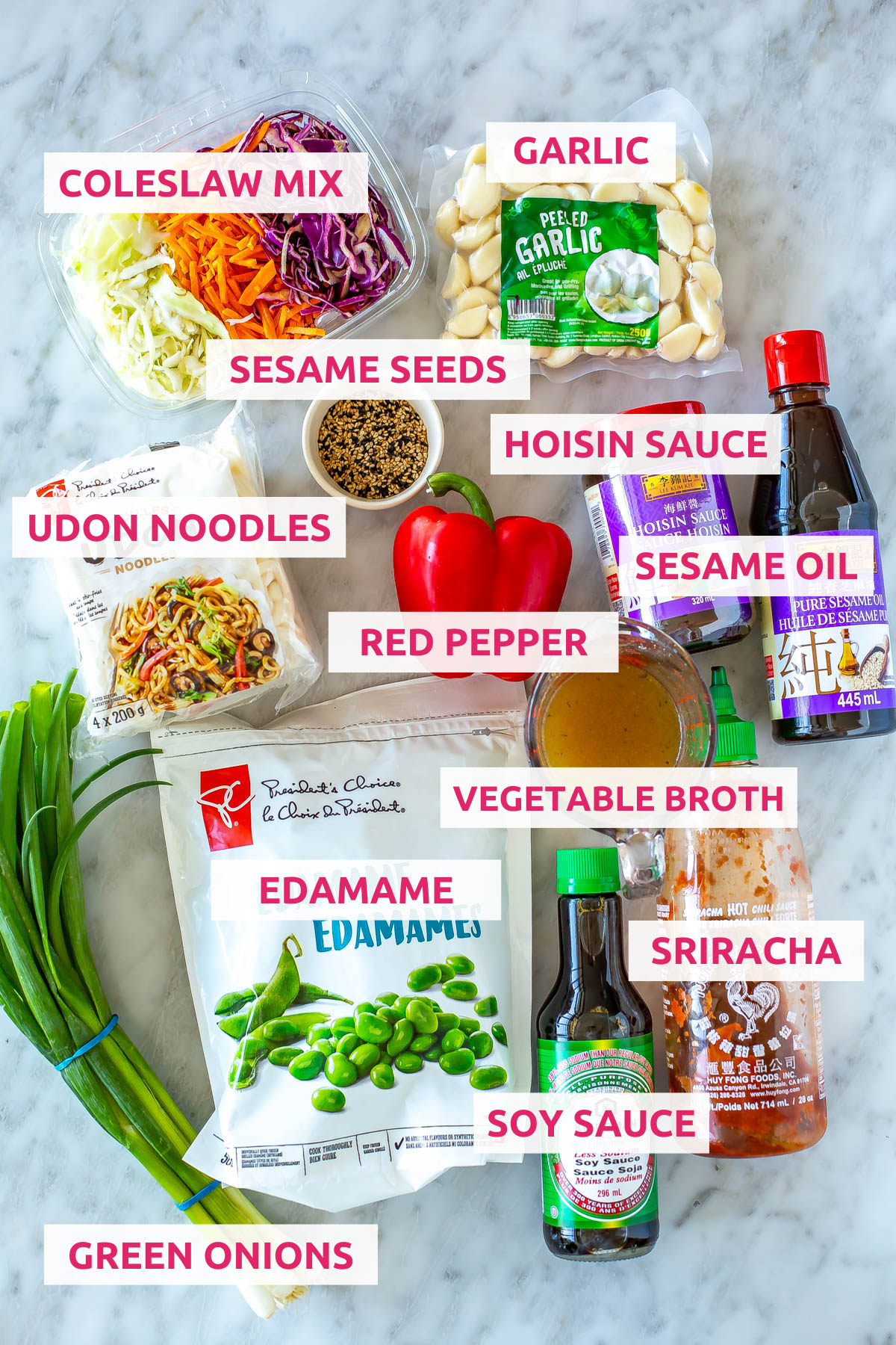 Ingredients for Udon Noodles: udon noodles, coleslaw mix, edamame, garlic, hoisin sauce, soy sauce, sesame oil, sriracha, green onions, vegetable broth, red pepper and sesame seeds.