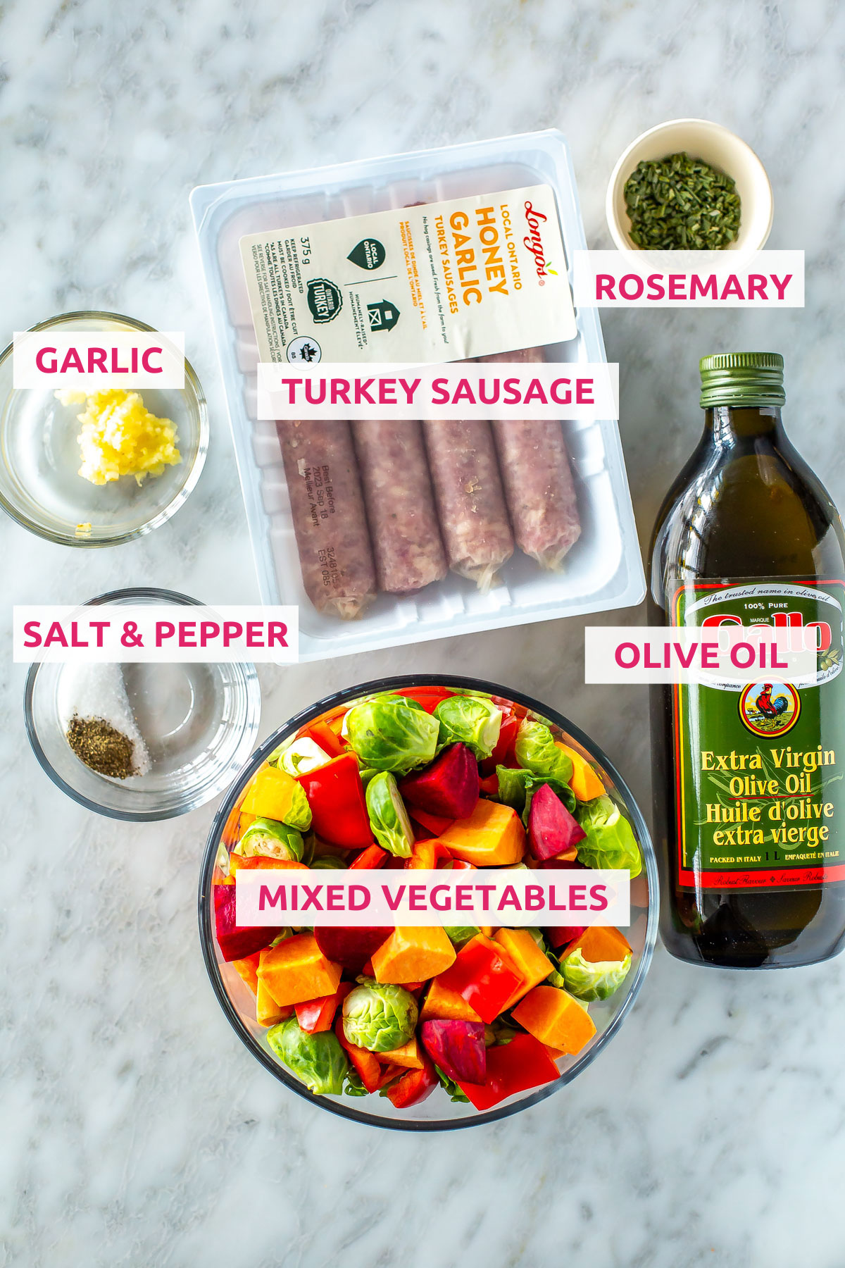 Ingredients for sheet pan sausage and vegetables: mixed vegetables, turkey sausage, olive oil, rosemary, garlic, salt and pepper.