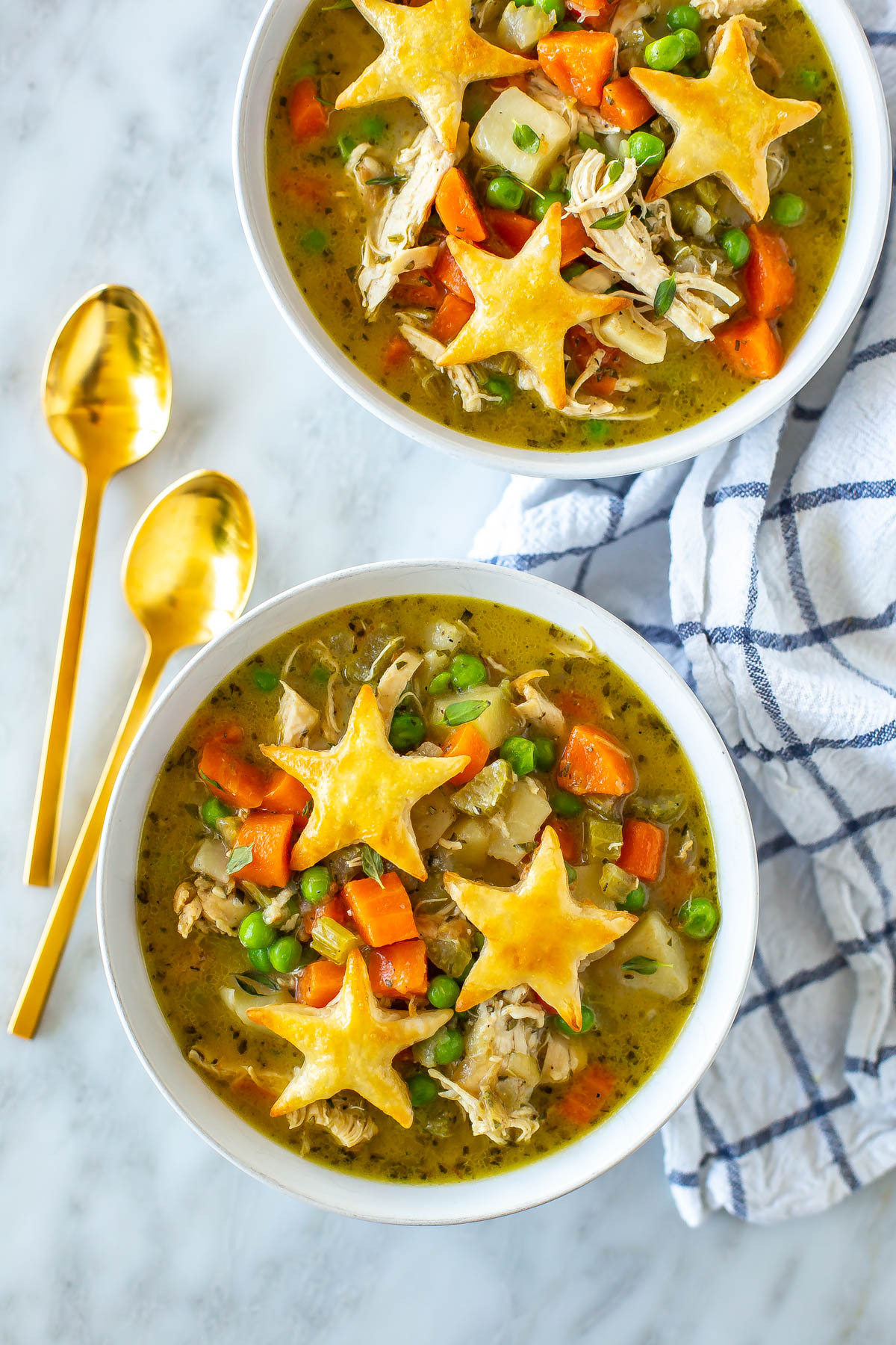 Two bowls of chicken pot pie soup.