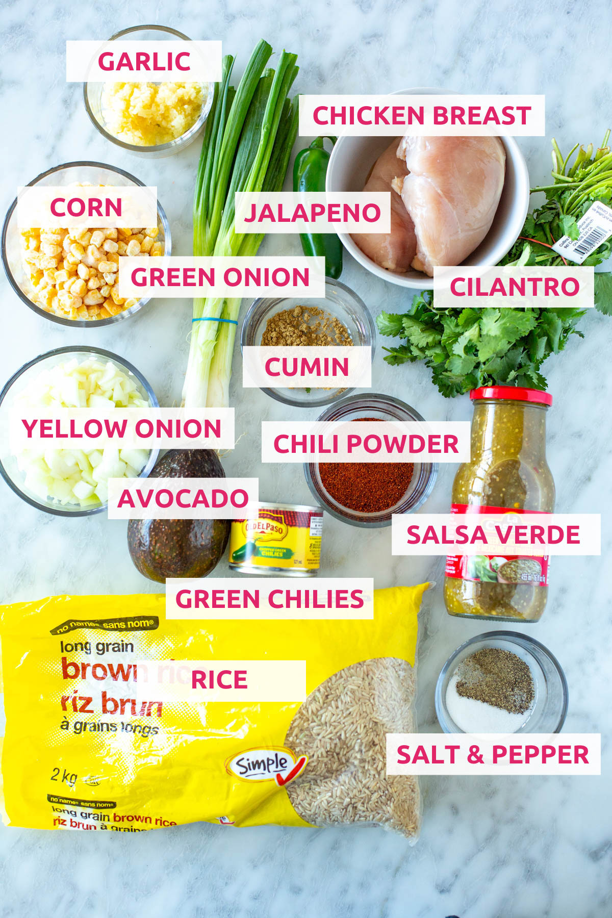 Ingredients for salsa verde chicken: rice, chicken breasts, green onions, garlic, corn, jalapeno, cilantro, yellow onion, avocado, green chilies, chili powder, salsa verde and salt and pepper.