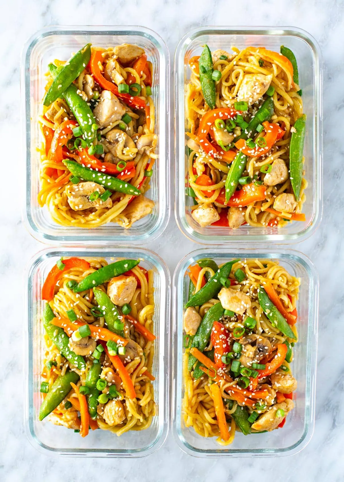 Chicken lo mein in glass meal prep bowls